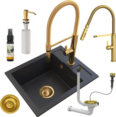 A black granite sink with gold fixtures and accessories, presented on a white background.