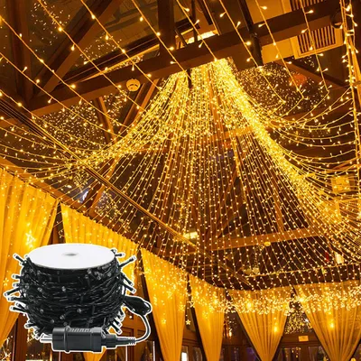 A room decorated with many strings of warm white LED lights hanging from the ceiling.