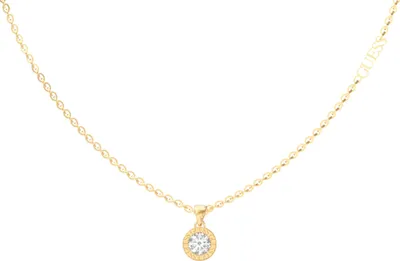 A gold necklace with a single pendant featuring a clear stone surrounded by smaller stones, on a white background.