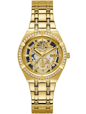 A gold Guess watch with a skeleton dial and crystal accents on a white background.