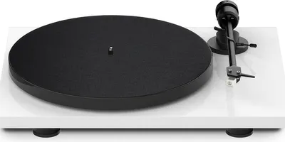 A white turntable with a black platter and tonearm, shown from a diagonal angle on a white background.