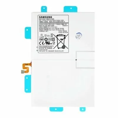A white Samsung battery with blue tabs and an orange connector.
