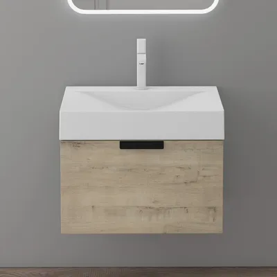 A modern bathroom vanity with a white sink and a wood-grain cabinet.