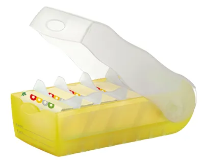 A yellow translucent business card holder with a translucent white lid open.