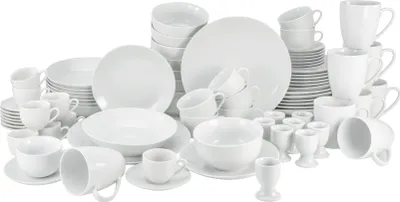 A collection of white ceramic dinnerware and drinkware is arranged on a white background.
