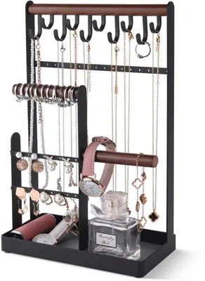Imagen del producto de Soporte para joyas Unyqoos® de metal, de múltiples niveles, con dimensiones de 20 x 10 x 32 cm. Incluye 34 orificios para pendientes, 2 soportes para pulseras, 10 ganchos, un estante forrado de terciopelo y una base antideslizante para collares y relojes