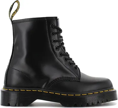 A black Dr. Martens boot is shown against a white background.