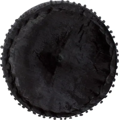 A top-down view of a round, black pouf with pom-pom trim.