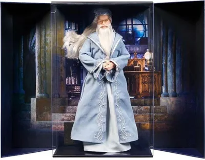 A doll of Albus Dumbledore in a display case with a backdrop of a library or study.