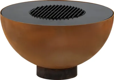 A close-up studio shot of a round, rusty-looking fire pit with a black grill insert.