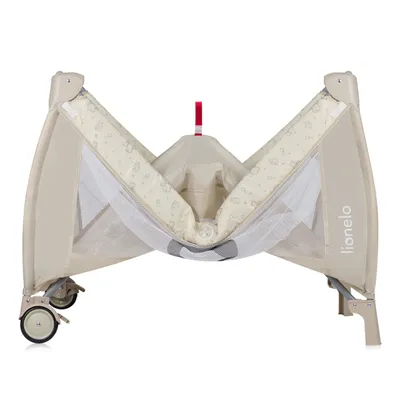 A baby travel cot is shown from a slightly elevated front-facing angle, with its sides partially open.