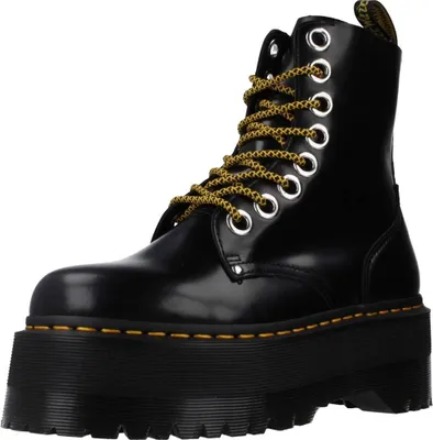 A black Dr. Martens Jadon Max boot with yellow laces is shown against a white background.