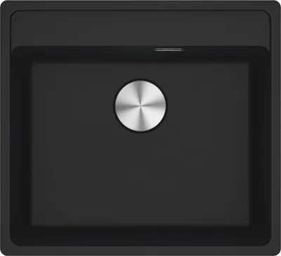 A top-down view of a black kitchen sink with a silver drain cover.
