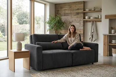Produktbild von Schlafsofa KOMO Apollo – mit Schlaffunktion, Cord in Schwarz, Family Meble, KI-generiertes Bild