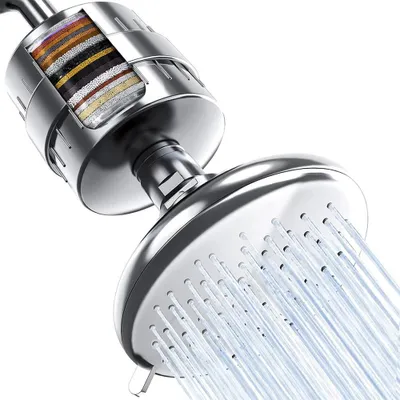 A close-up, cutaway view of a shower head with a visible multi-layer filter inside, showing water spraying from the shower head.