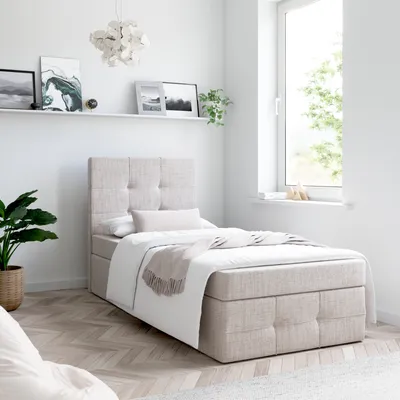 A bedroom setting with a bed.