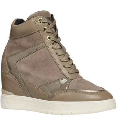 A single women's wedge sneaker is shown against a white background.
