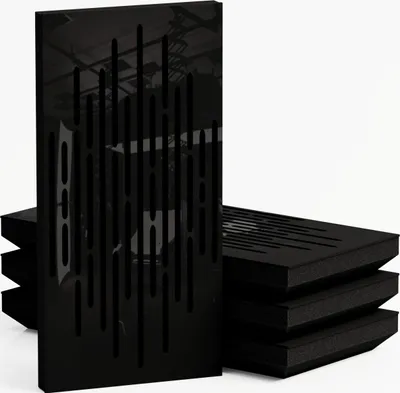 A stack of black acoustic panels with a glossy black panel in the foreground.