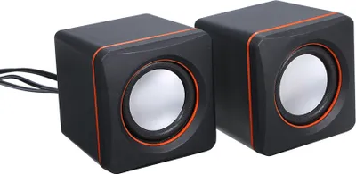 A pair of small black desktop speakers with orange trim and silver speaker cones, shown against a white background.