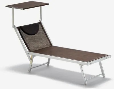 A single beach lounger with a sunshade.