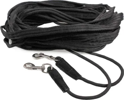 A black lunge line with two metal clips is laid out on a white background.