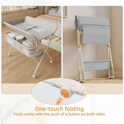 Immagine prodotto di Tavolino fasciatoio – Con rotelle – Cesto portaoggetti laterale – Struttura in metallo – Capacità massima: 25 kg – Design ergonomico – Grigio