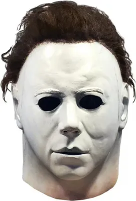 A close-up front view of a Michael Myers mask with brown hair.