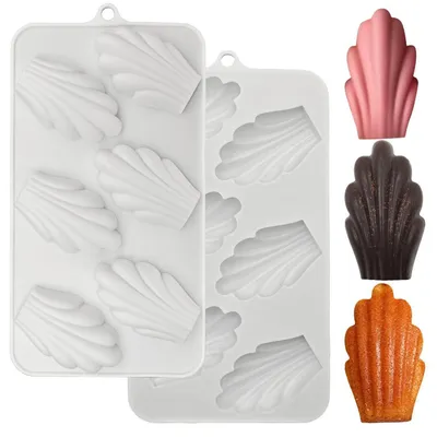 Productafbeelding van Siliconen vorm voor madeleinekoekjes, 6 caviteiten, 2 stuks. Cakevorm, afmetingen 3,8 x 6,5 cm. Hittebestendig