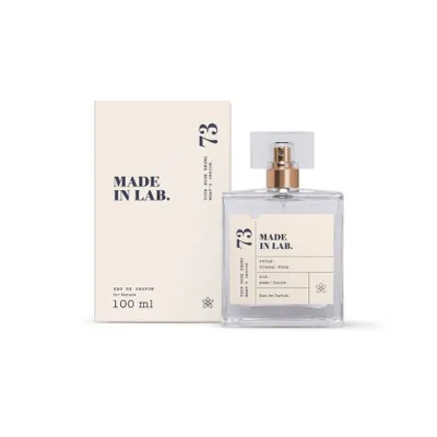 A perfume bottle and its box are displayed against a white background.