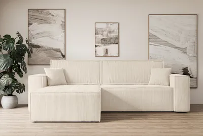 A modern living room with a beige sectional sofa.
