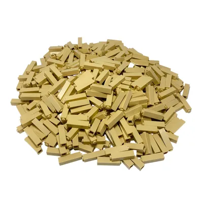 A pile of beige LEGO bricks on a white background.