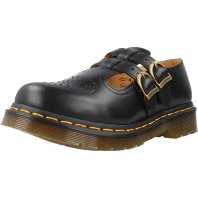 A single black Dr. Martens Mary Jane shoe is shown from a three-quarter side view against a white background.
