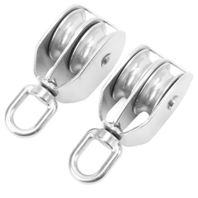 Two stainless steel double pulleys are shown against a white background.