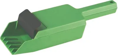 A green plastic scoop with a black roller on top, isolated on a white background.