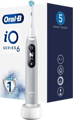 An Oral-B iO Series 6 electric toothbrush and its packaging are displayed against a white and dark gray background.