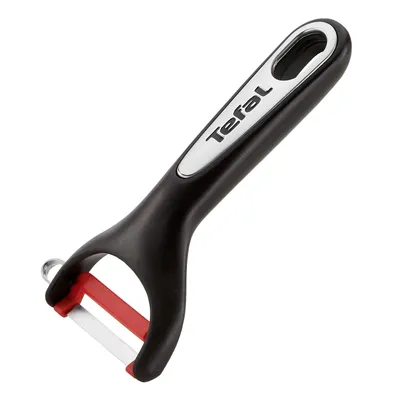 A studio shot of a black and red peeler with the Tefal logo on the handle.
