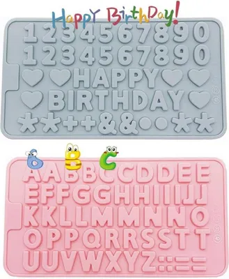 Two silicone molds for baking, one gray with numbers, hearts, and the words "Happy Birthday", and one pink with letters and symbols. Small cartoon characters are placed on top of the pink mold.