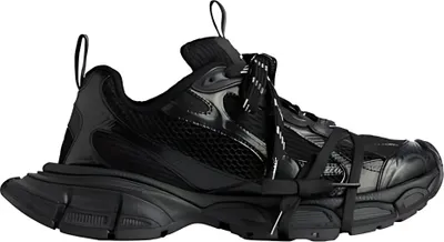 A studio shot of a single black sneaker against a white background.