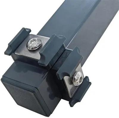 A close-up view of a corner post for a double bar fence, showing the metal construction and fasteners.