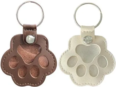 Produktbild von Tierhaar-Opbehrschränke, Tierhaar-Opbehrsäcke, Tierhaar-Schlüsselanhänger als Andenken, Leder-Schlüsselanhänger in Form von Hundepfoten und Katzenpfoten