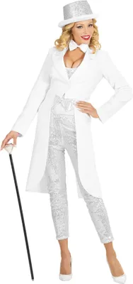 A woman in a white tuxedo costume with silver sequins, holding a cane.