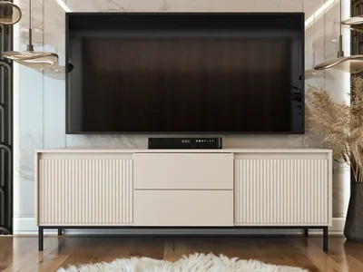 A modern TV stand with a large television mounted above it, set in a well-lit, stylish room.
