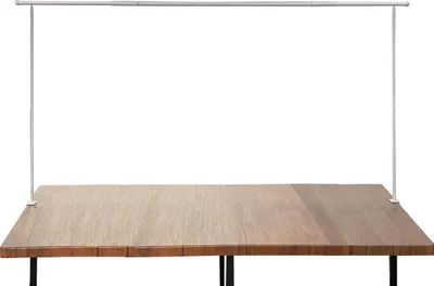 A table frame attached to a wooden tabletop.