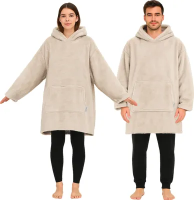 A man and a woman are shown wearing oversized hoodie blankets.