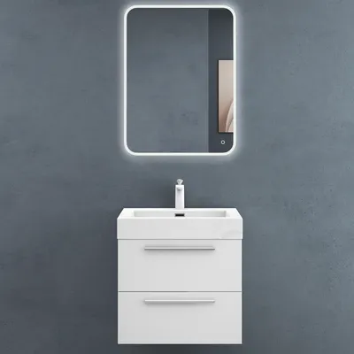 A white bathroom vanity with a sink and faucet mounted on a gray wall.