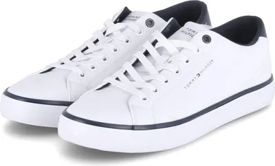 A pair of white low-top sneakers with navy accents.