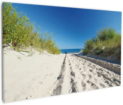 Produktbild von Wallario Premium Leinwandbild Auf dem Sandweg zum Strand - Blauer Himmel über dem Meer in Größe 60 x 90 cm