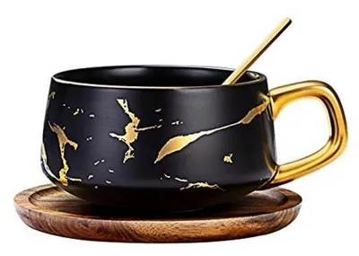 Immagine prodotto di Set di 3 tazze per espresso da 300 ml, con finitura effetto marmo, in porcellana nera. Il set comprende: 1 tazza, 1 piattino, 1 cucchiaino
