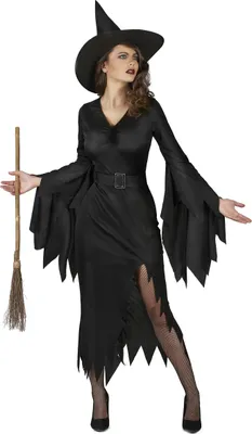 A woman dressed as a witch holding a broom.