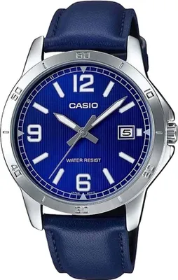 A close-up studio shot of a Casio analog watch with a blue dial and a blue leather strap.